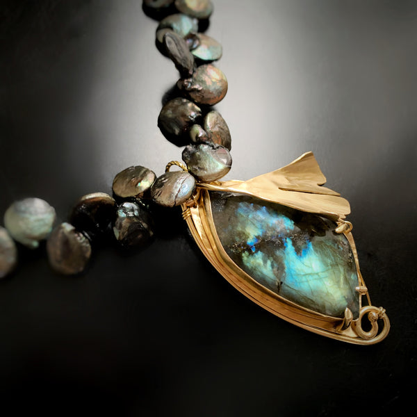 Handmade one of a kind jewelry by Erica Bapst.  This brass pendant features a signature ginkgo leaf adorning a labradorite stone. 