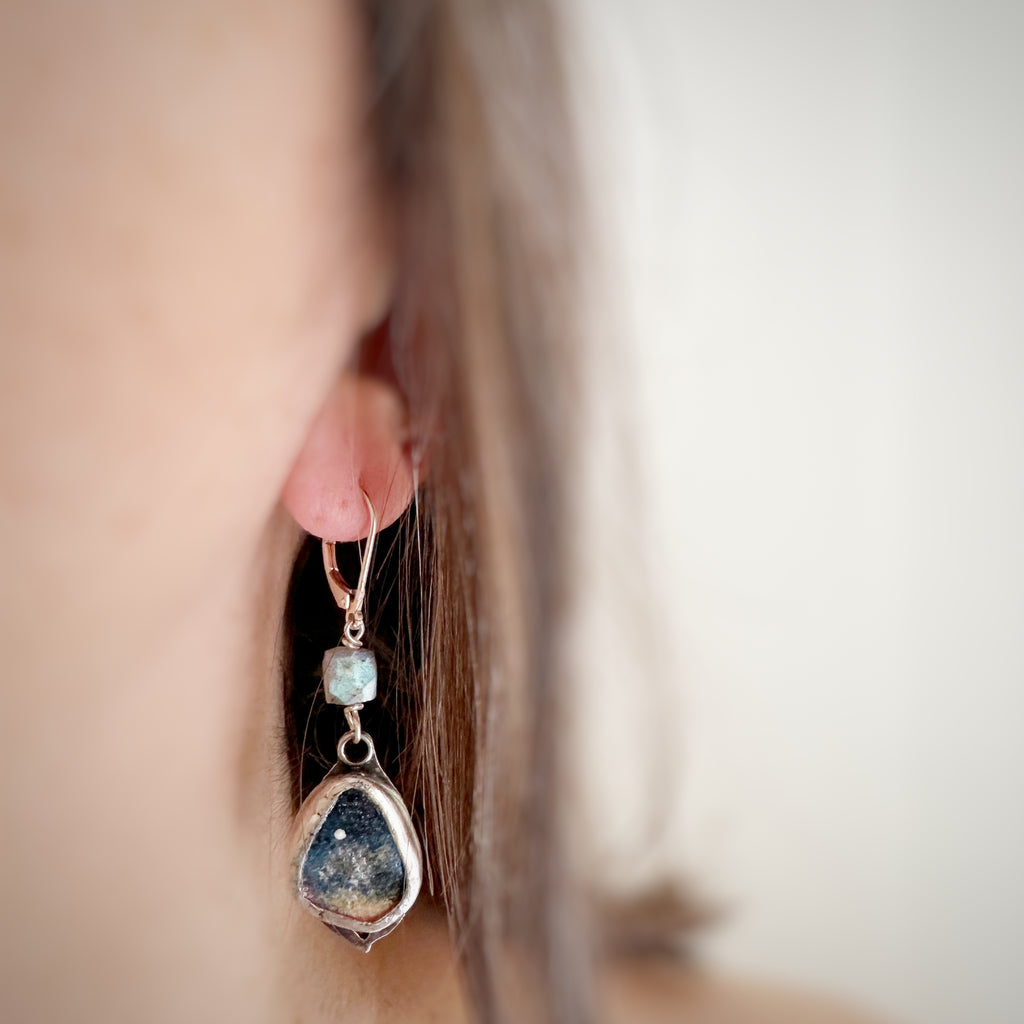 Hand painted canvas depicting a very early morning sky with a single star shining. The hand built sterling silver setting is topped with a flashy blue labradorite cube.