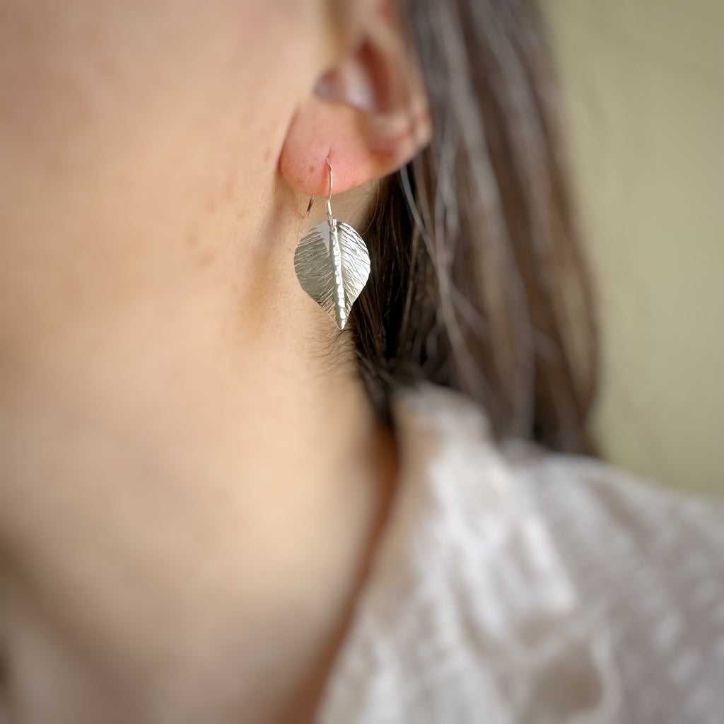medium hand formed and hammer textured leaves made of sterling silver.