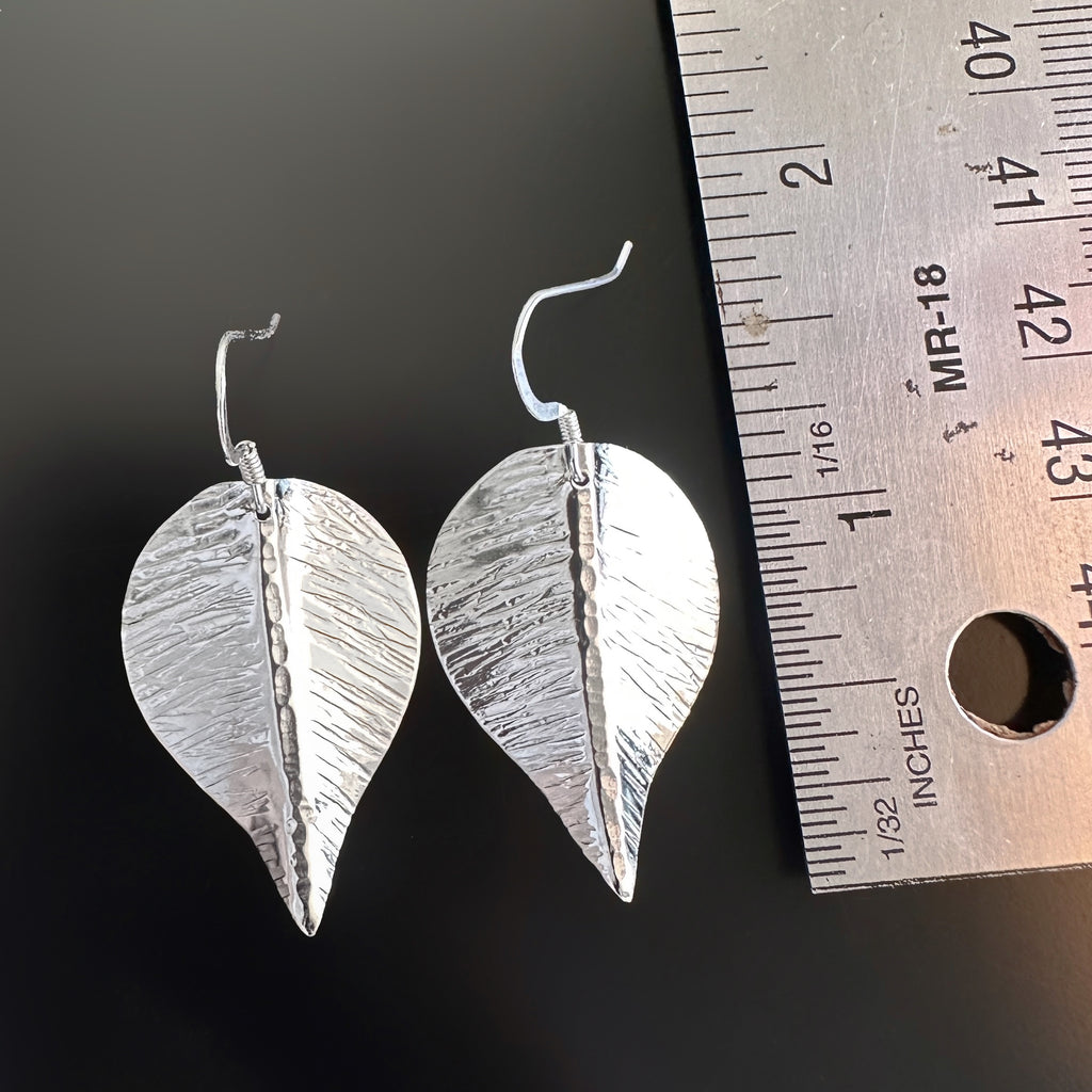 extra large hand formed and hammer textured leaves made of sterling silver measurement.