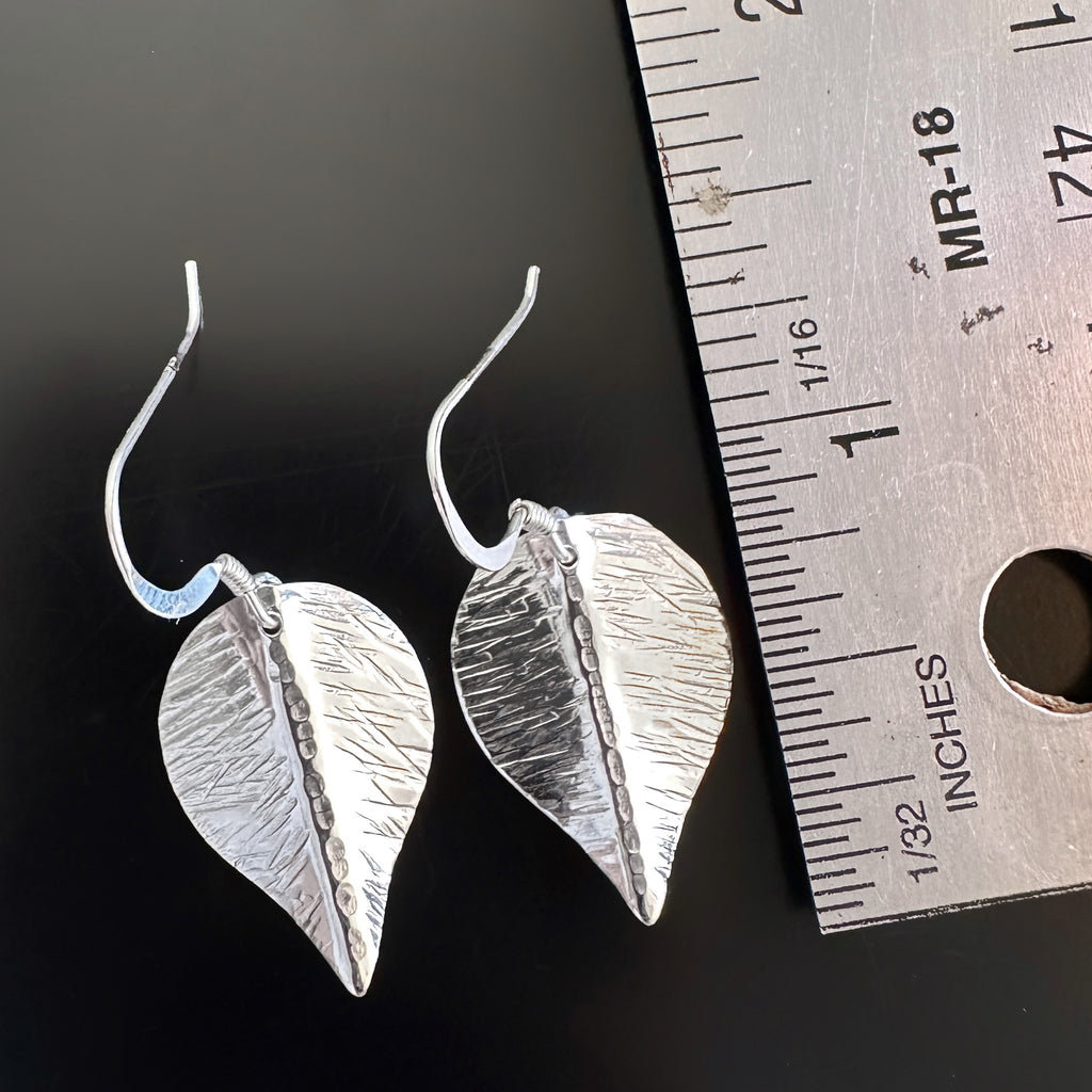 medium hand formed and hammer textured leaves made of sterling silver measurement.