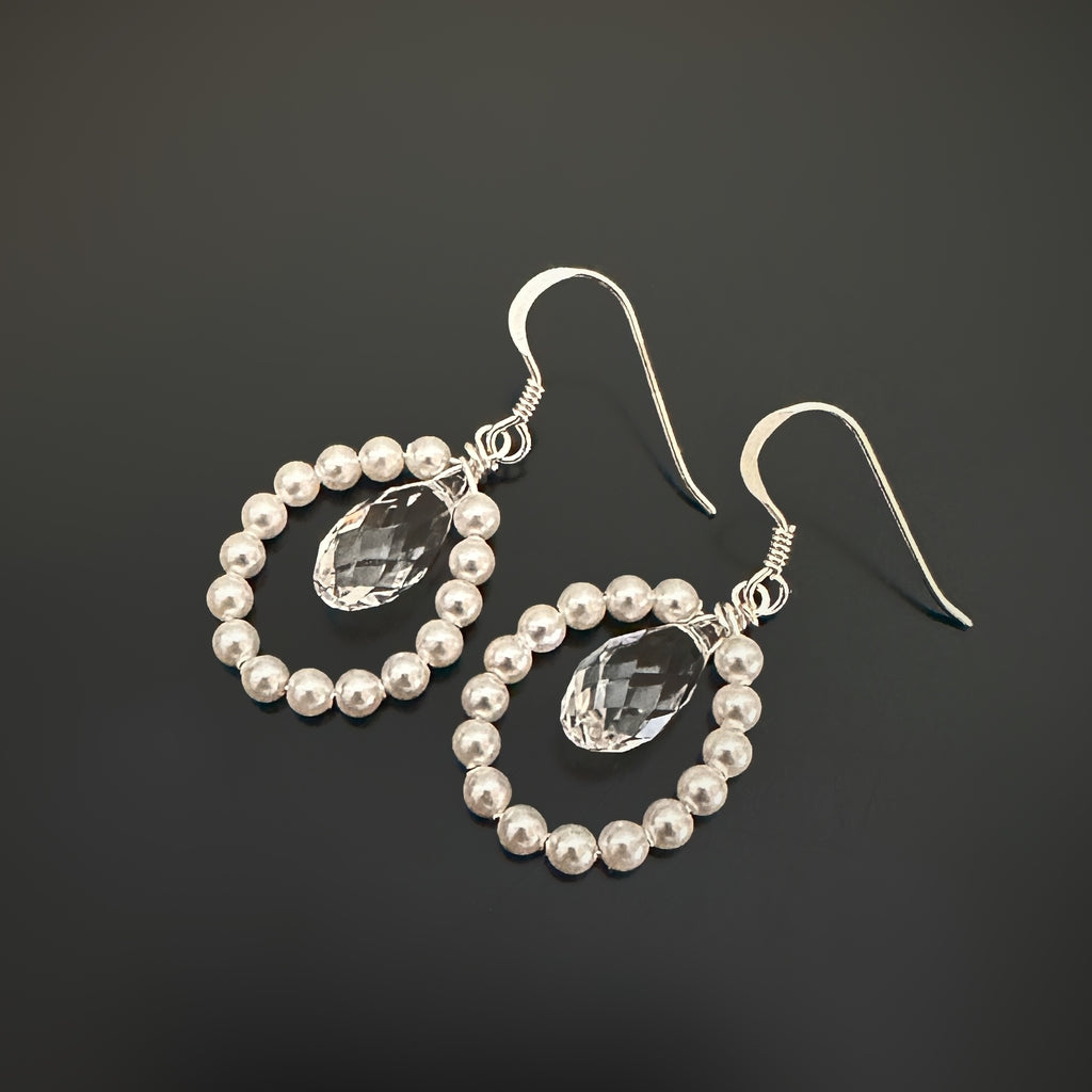 Sterling silver, clear crystal and white pearl teardrop earrings with french hook ear wires.