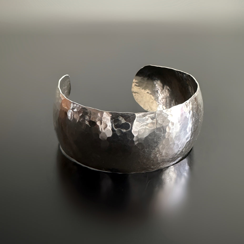 wide 1" sterling silver cuff bracelet with domed shape and hammered texture