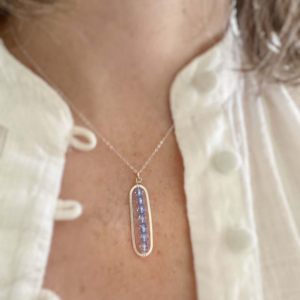 Paper Clip Style sterling silver pendant with light blue sapphire crystals