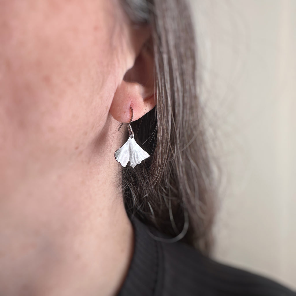 surgical grade hypoallergenic and tarnish resistant 304 stainless steel ginkgo leaf dangle earring in the small size.