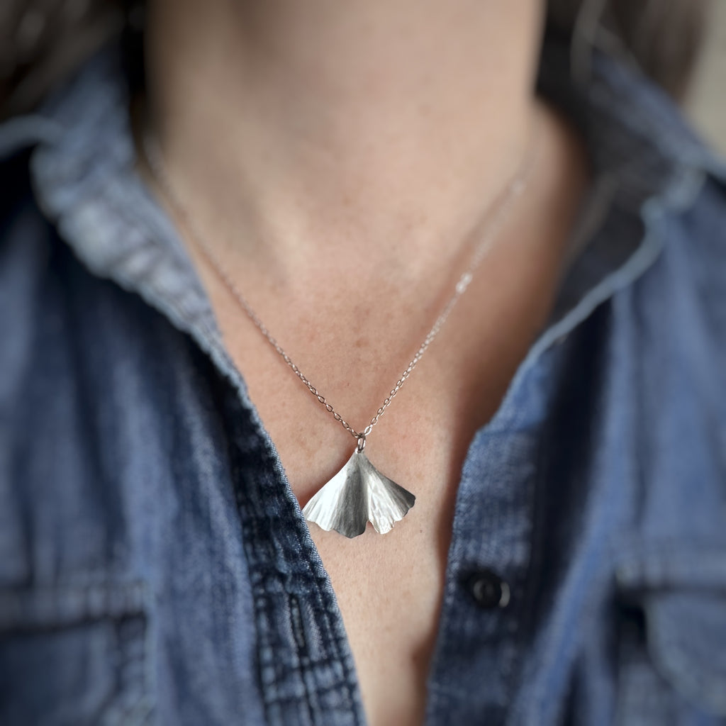 surgical grade hypoallergenic and tarnish resistant 304 stainless steel ginkgo leaf pendant on a chain necklace in the medium size.