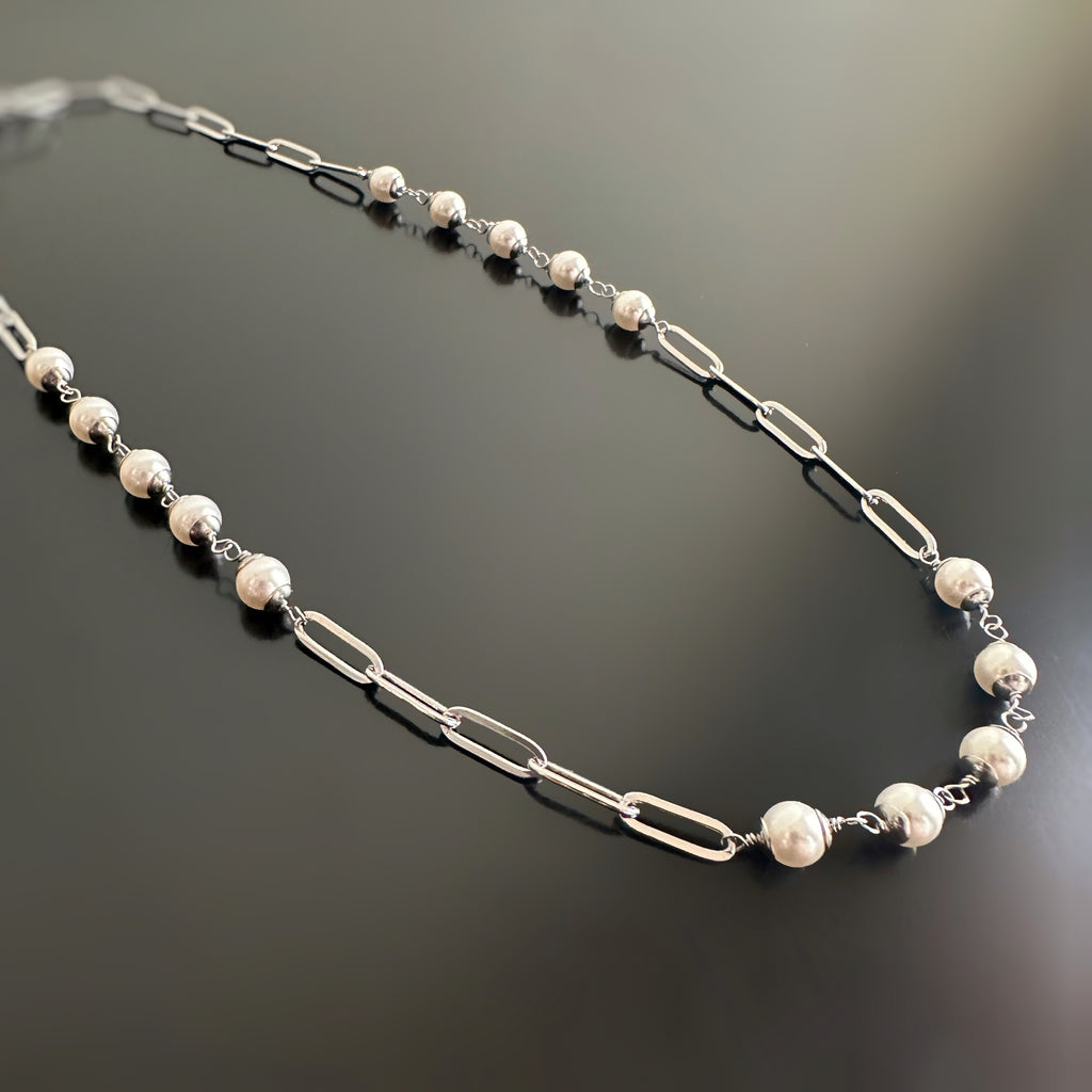 paperclip style chain, silvery surgical steel with 6mm white crystal pearl links within the chain.