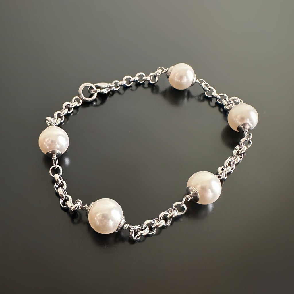 classic white round crystal pearls set within a 3.5 mm rolo style surgical steel chain.