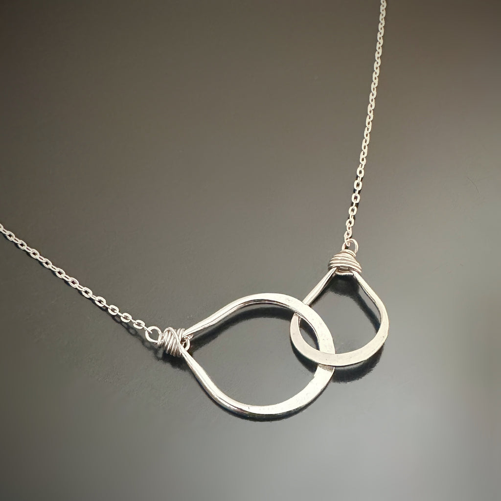 Two dainty handmade sterling silver interlocking teardrops on an adjustable length chain 16"-18"