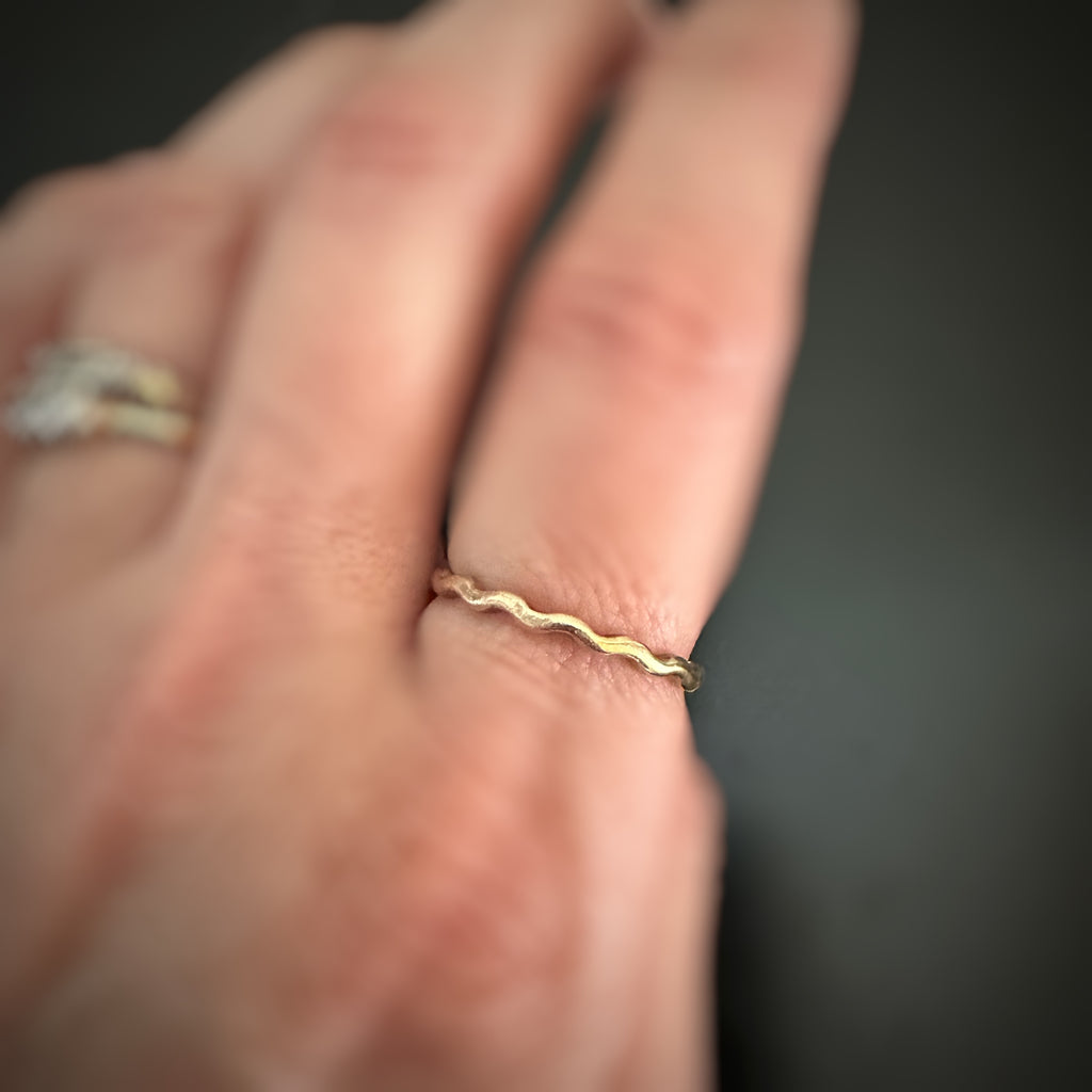 14k gold-filled wave ring shown on model