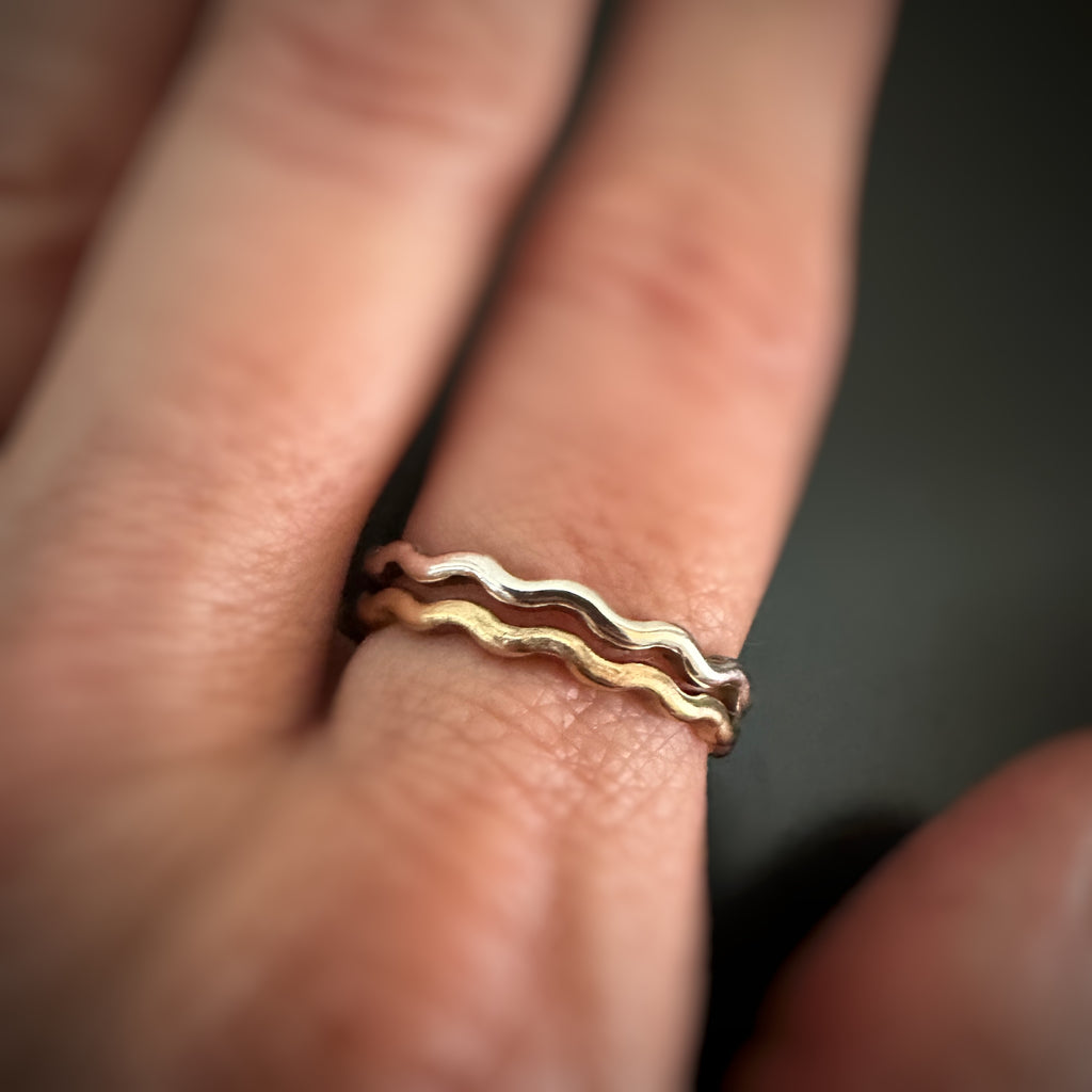 shown on model are both the sterling silver and the 14k gold-filled versions of the wave ring stacked together.