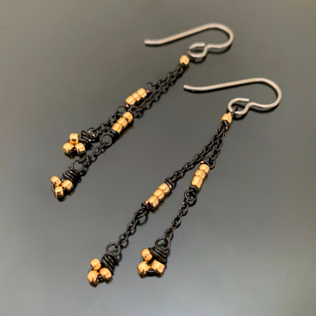 lightweight and long earrings with black chain and golden beads