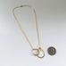 Interlocking loops in gold handmade pendant necklace