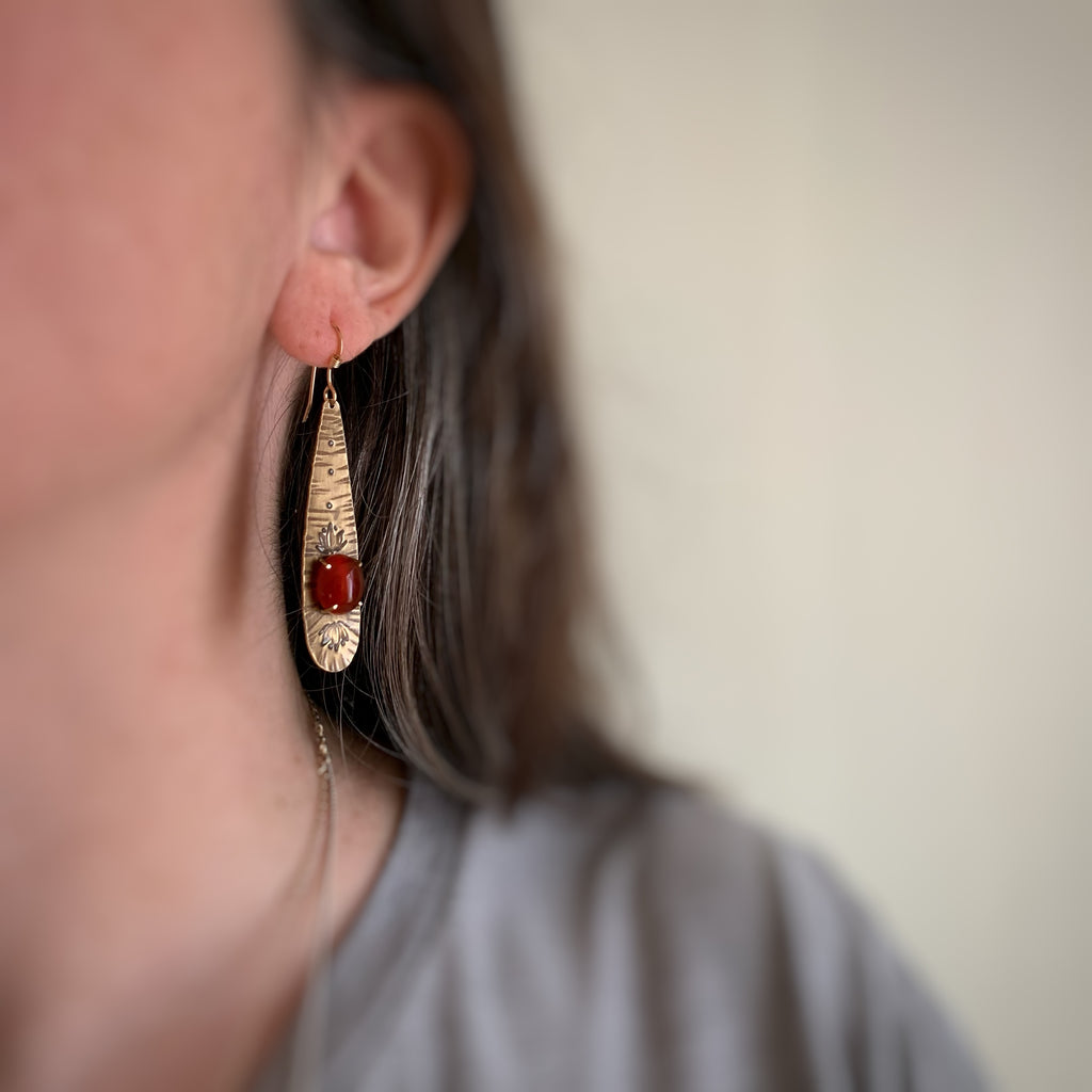 Long Golden Teardrop Earrings with Carnelian and Lotus Flower Motif