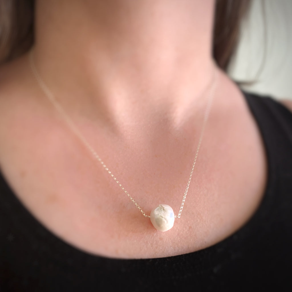 large white freshwater pearl necklace on a sterling silver chain