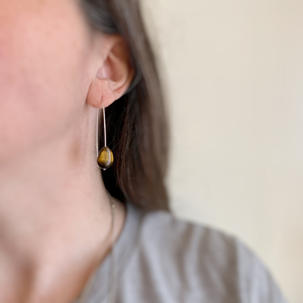 Sterling silver pin wire earrings with tigers eye teardrops.