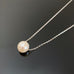 White freshwater pearl sliding pendant on sterling silver chain necklace.