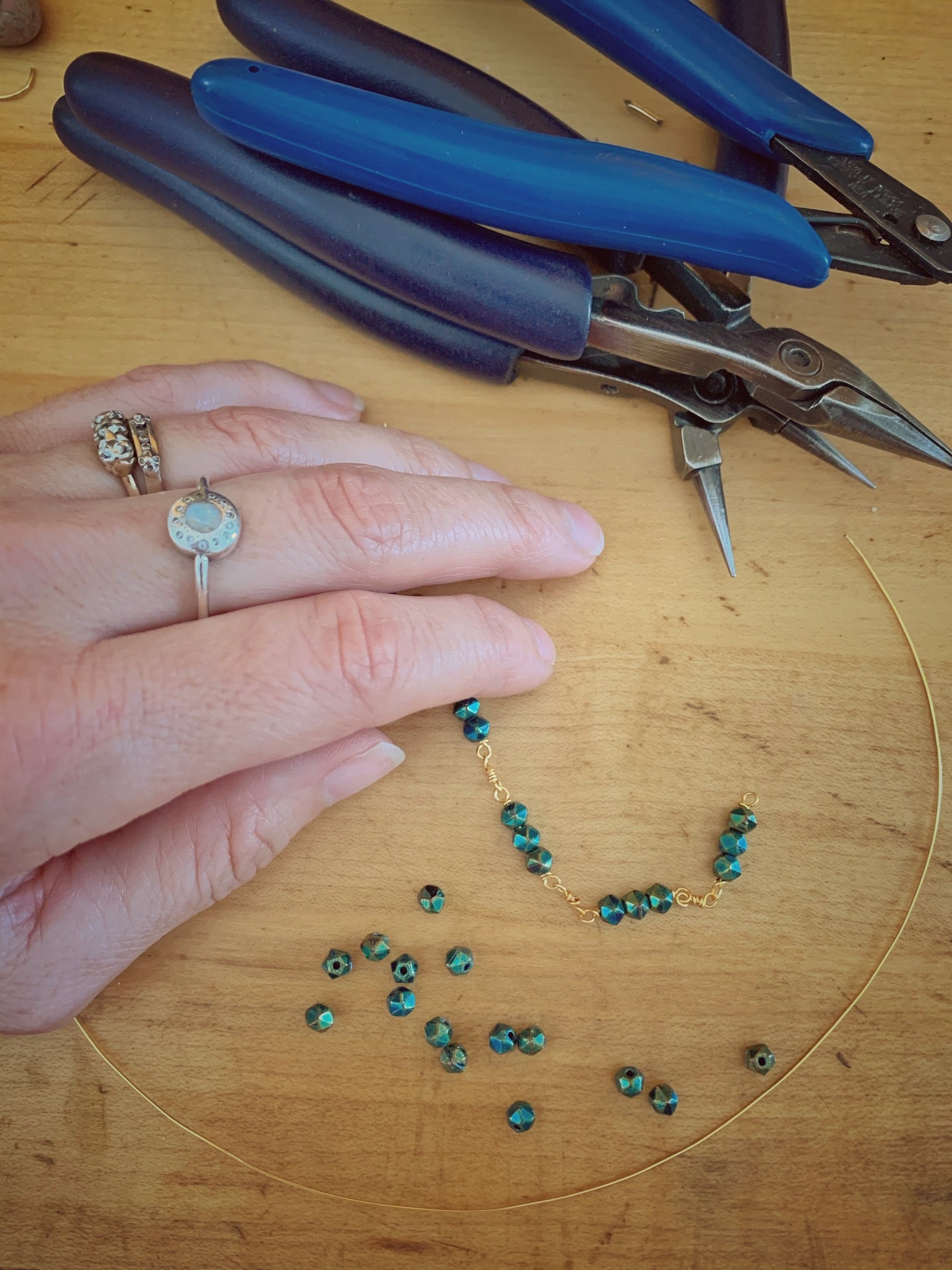 Erica Bapst working on a hand made chain.