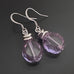 Purple lilac transparent glass faceted nugget drop earrings with silvery accents and surgical steel ear wires.