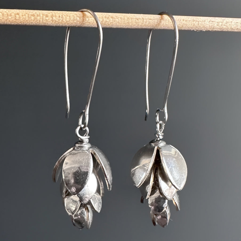 Long statement earrings handmade from vintage silverplate and designed to emulate the image of hops flowers. They have a long shepherd hook style ear wire.