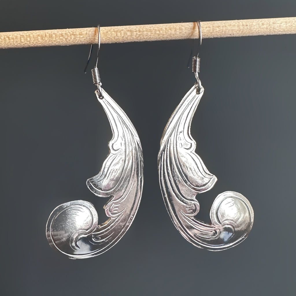 Statement earrings made of vintage silverplate in an engraved scrollwork style and hang from a french hook style 304 grade surgical steel ear wire.  