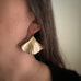 Extra large 14k gold filled ginkgo leaf earrings shown on model. 