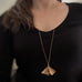 Extra large 14k gold filled ginkgo leaf pendant necklace show on model.
