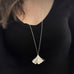 Extra large sterling silver ginkgo leaf pendant necklace on model.