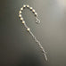 Handmade sterling silver and white freshwater pearl decade rosary bracelet that is adjustable in length.