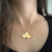 Large 14k gold filled ginkgo leaf pendant necklace shown on model.