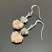 Light sage green colored Czech glass leaf beaded earring with a silvery heart on top.