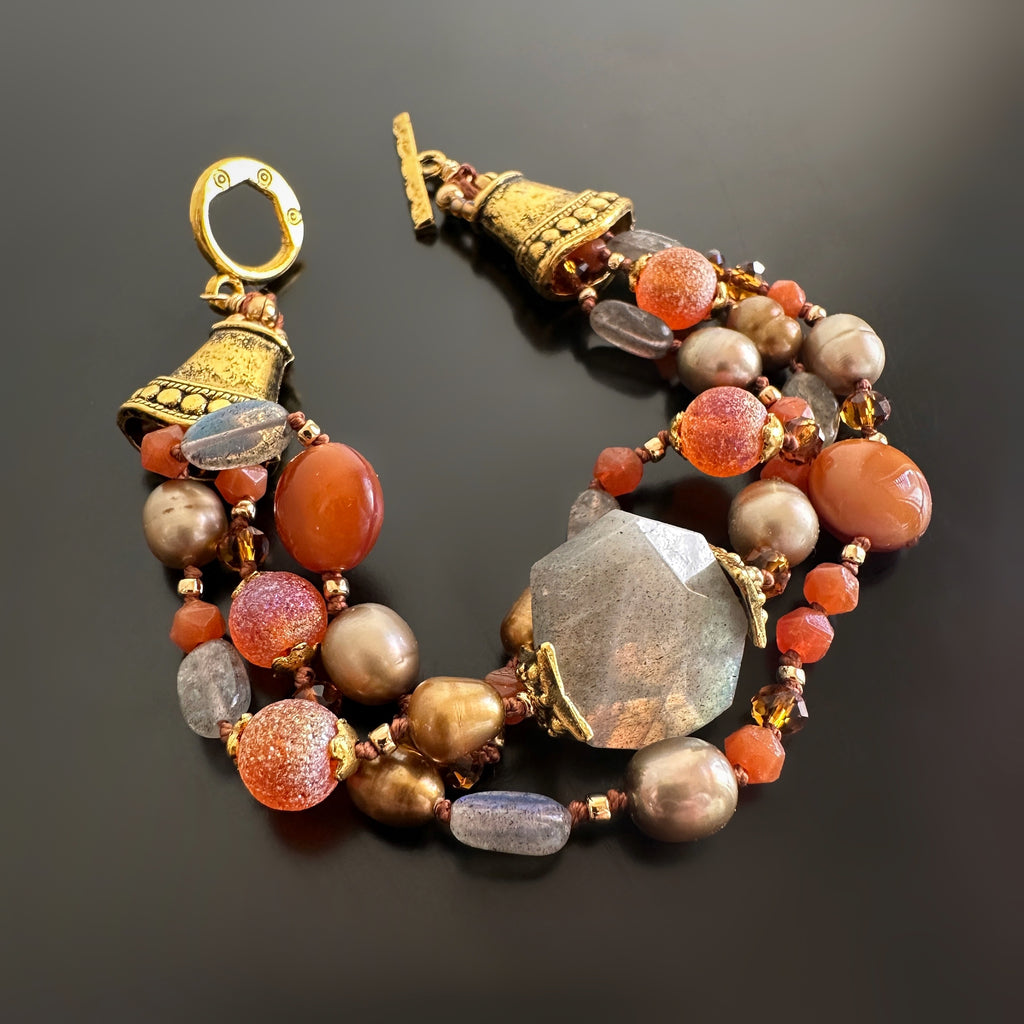 Hand-knotted, orange hue, three strand bracelet with labradorite, freshwater pearls, glass and golden accents.