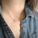 handmade sterling silver clover pendant shown on model