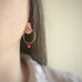 handmade sterling silver hoop earrings with a small cherry red Austrian crystal teardrop dangle.