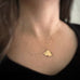 Small 14k gold-filled pendant necklace shown on model.