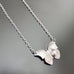 silver tone surgical steel butterfly pendant with hammered details in the wings, on a dainty chain