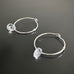 handmade sterling silver hoop earrings with a small clear Austrian crystal teardrop