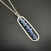 Paper Clip Style sterling silver pendant with light blue sapphire crystals