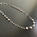 paperclip style chain, silvery surgical steel with 6mm white crystal pearl links within the chain.