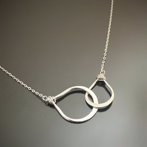 Two dainty handmade sterling silver interlocking teardrops on an adjustable length chain 16"-18"
