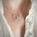 The focus of this necklace are the handmade sterling silver double teardrop shapes interlocking and connected to an adjustable length sterling chain