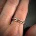 shown on model are both the sterling silver and the 14k gold-filled versions of the wave ring stacked together.