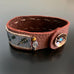 Brown leather strap bracelet with hand woven seed beads and flower button clasp featuring labradorite and tiger eye