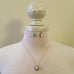 gold necklace and earring set with clear AB emerald cut rhinestone crystals