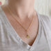 delicate golden necklace with a ginkgo leaf pendant