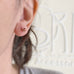 goldstone round shape sterling silver post earrings