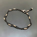 two strand bracelet with black chain and silver beads