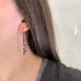 delicate and lace like earrings with black chain and gold beads