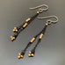 lightweight and long earrings with black chain and golden beads