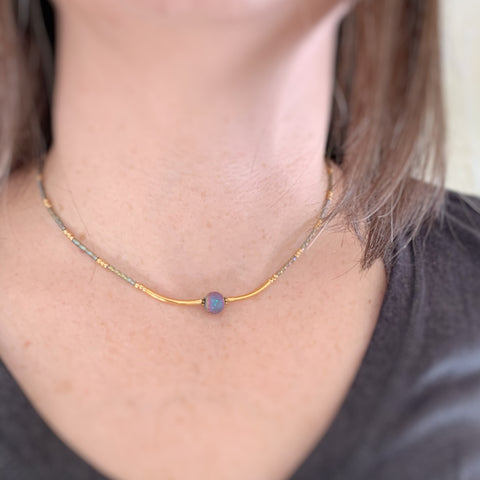 adjustable length choker necklace with gold accents, ancient looking purple glass focal and twisted column glass beads